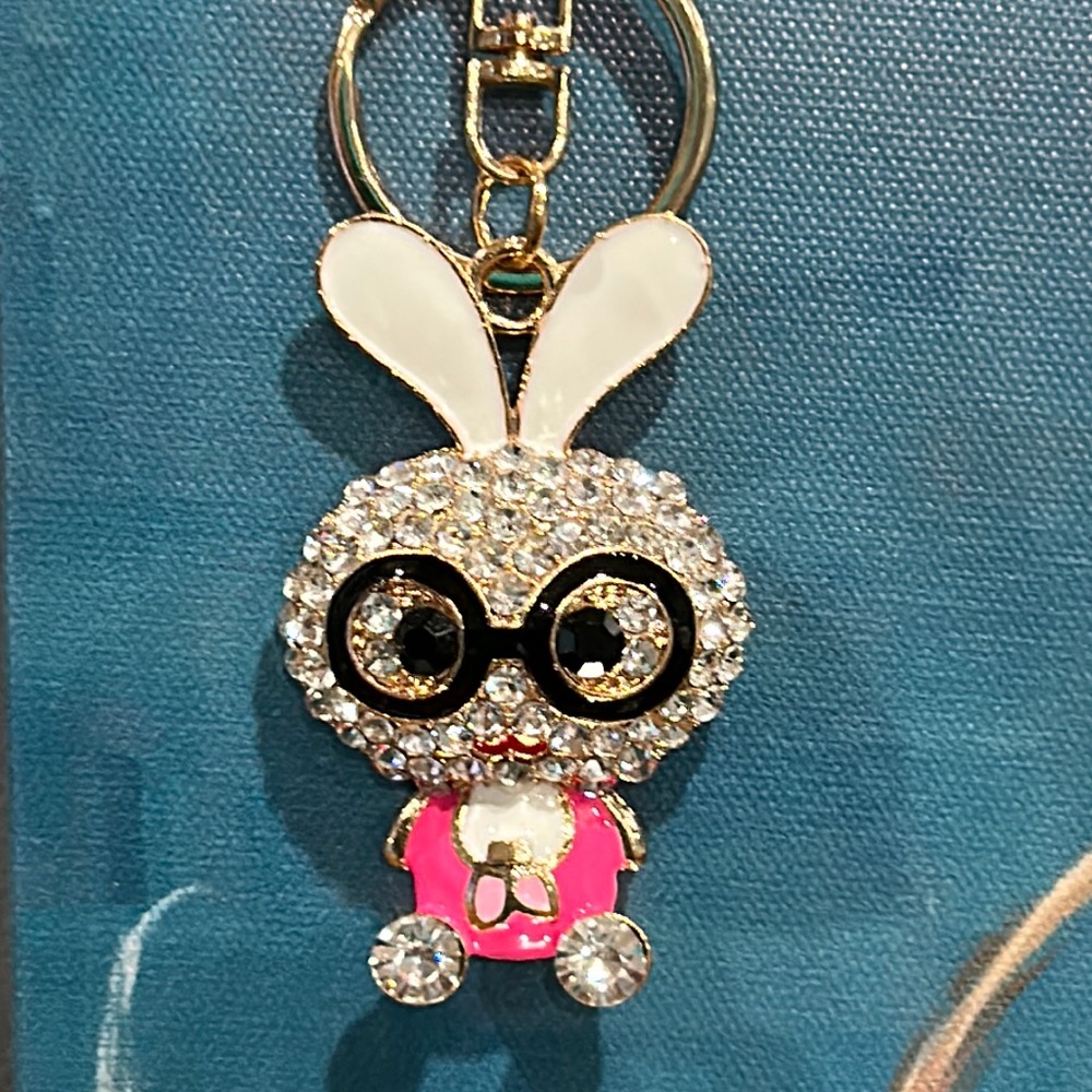 Bedazzled bunny keychain in white rhinestones. She is sassy and means business!